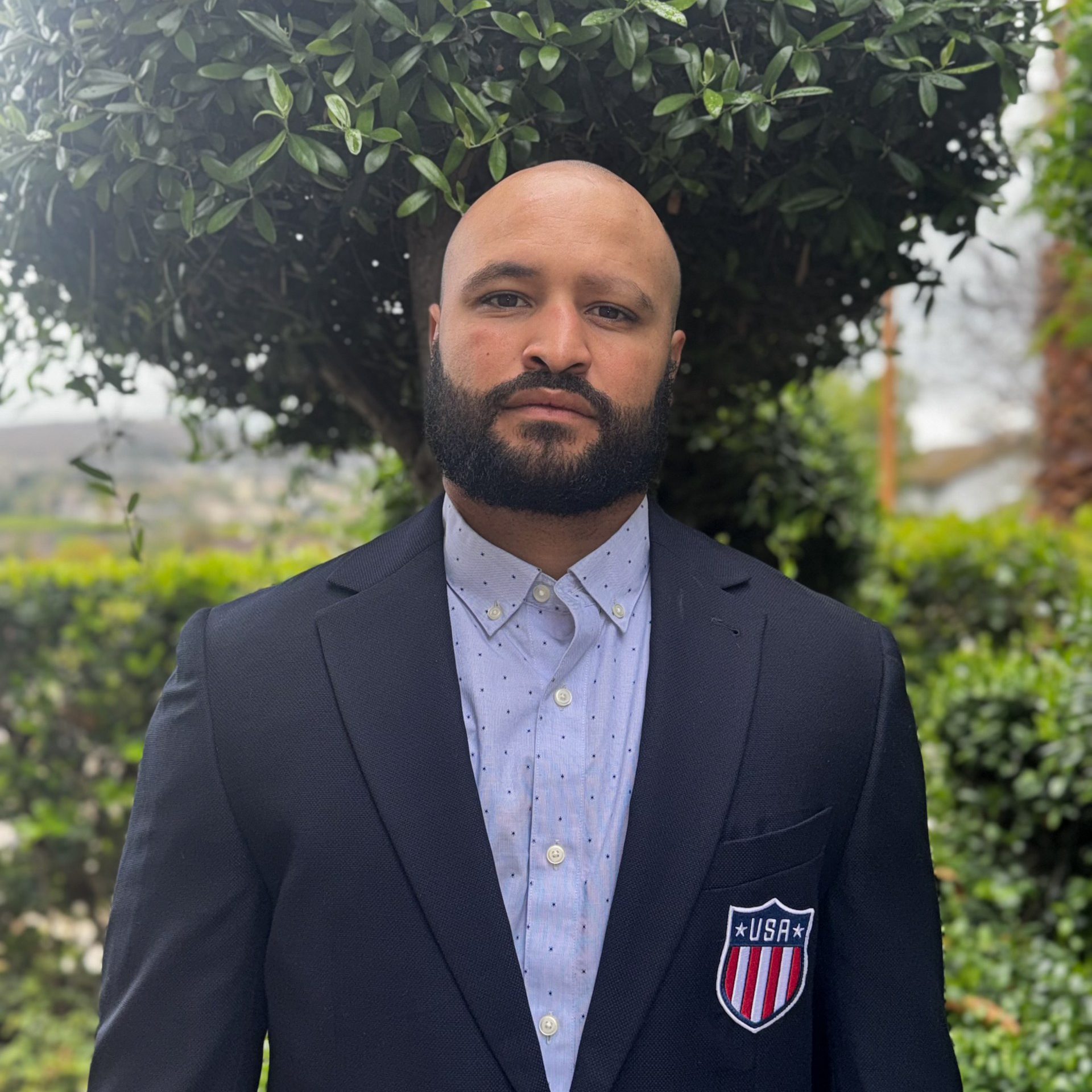 Professional insurance agent in formal suit for energy and oil & gas industries.